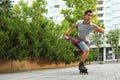 Handsome young man roller skating. Recreational activity Royalty Free Stock Photo