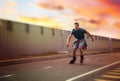 Handsome young man roller skating. Recreational activity Royalty Free Stock Photo