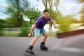 Handsome young man roller skating Royalty Free Stock Photo