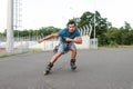 Handsome young man roller skating. Recreational activity Royalty Free Stock Photo