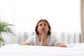 Handsome young man saying bedtime prayer Royalty Free Stock Photo