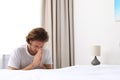 Handsome young man saying bedtime prayer at home Royalty Free Stock Photo