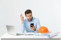 Handsome young man serious working in engineering office. Royalty Free Stock Photo