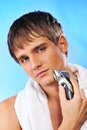 Handsome young man shaving Royalty Free Stock Photo