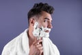 Handsome young man shaving Royalty Free Stock Photo