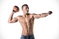 Handsome, young man shirtless, throwing american football ball Royalty Free Stock Photo