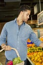 Handsome young man shopping in market