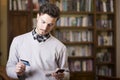 Handsome young man shopping online on mobile phone Royalty Free Stock Photo