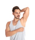 Handsome young man showing armpit Royalty Free Stock Photo