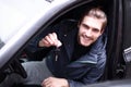 Handsome young man showing the key of new car Royalty Free Stock Photo