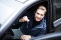 Handsome young man showing the key of new car Royalty Free Stock Photo