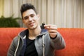 Handsome young man showing USB key in his hand Royalty Free Stock Photo