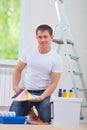 Handsome young man sitting on floor Royalty Free Stock Photo