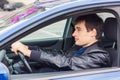 Handsome young man sitting in his car Royalty Free Stock Photo