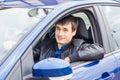 Handsome young man sitting in his car Royalty Free Stock Photo