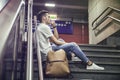 Handsome young man sitting on stairs Royalty Free Stock Photo