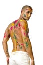 Handsome young man with skin all painted with Holi Royalty Free Stock Photo