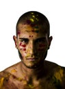 Handsome young man with skin all painted with Holi Royalty Free Stock Photo