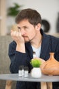 handsome young man smelling cologne or perfume on neck Royalty Free Stock Photo