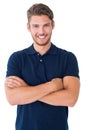 Handsome young man smiling with arms crossed Royalty Free Stock Photo