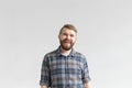 Handsome young man smiling and laughing on white background with copy space Royalty Free Stock Photo