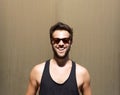 Handsome young man smiling with sunglasses Royalty Free Stock Photo