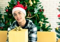 Man with a big yellow gift box on Christmas day Royalty Free Stock Photo