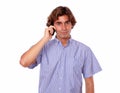 Handsome young man speaking on cellphone Royalty Free Stock Photo