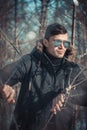 A handsome young man with spectacles in the Park