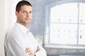 Handsome young man standing arms crossed Royalty Free Stock Photo