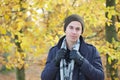 Handsome young man standing outdoors with jacket hat scarf and gloves Royalty Free Stock Photo