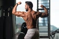 Muscular Man Flexing Back Muscles Pose Royalty Free Stock Photo