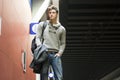 Handsome young man standing in train or subway station Royalty Free Stock Photo