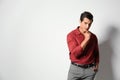 Handsome young man in stylish clothes on beige background. Space for text Royalty Free Stock Photo