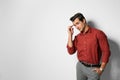 Handsome young man in stylish clothes on light  background. Space for text Royalty Free Stock Photo