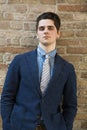 Handsome young man in suit against brick wall Royalty Free Stock Photo