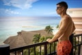 Handsome young man in swimsuit in the caribbean