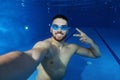 Handsome young man taking a underwater selfie Royalty Free Stock Photo