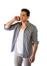 Handsome young man talking on cell phone, smiling Royalty Free Stock Photo