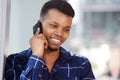 Handsome young man talking on mobile phone smiling Royalty Free Stock Photo