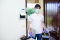 Handsome young man telephone operator worker fixing internet issue connexion at client house with surgical mask and gloves COVID19