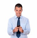 Handsome young man texting with his cellphone Royalty Free Stock Photo