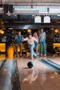 Handsome young man throwing bowling ball Royalty Free Stock Photo