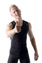 Handsome young man with thumb up doing OK sign Royalty Free Stock Photo