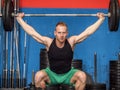 Young man training legs in gym Royalty Free Stock Photo