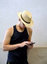 Handsome young man traveling on Kyoto and looking at his mobile phone. Royalty Free Stock Photo