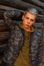 Handsome young man in a trendy military jacket with hoodie Royalty Free Stock Photo