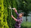Man trimming bushes in garden Royalty Free Stock Photo
