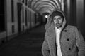 Handsome young man under cloisters in Italian city at night Royalty Free Stock Photo