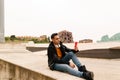 Handsome young man using his mobile phone on the street communicating with his friends through social media and high speed Royalty Free Stock Photo